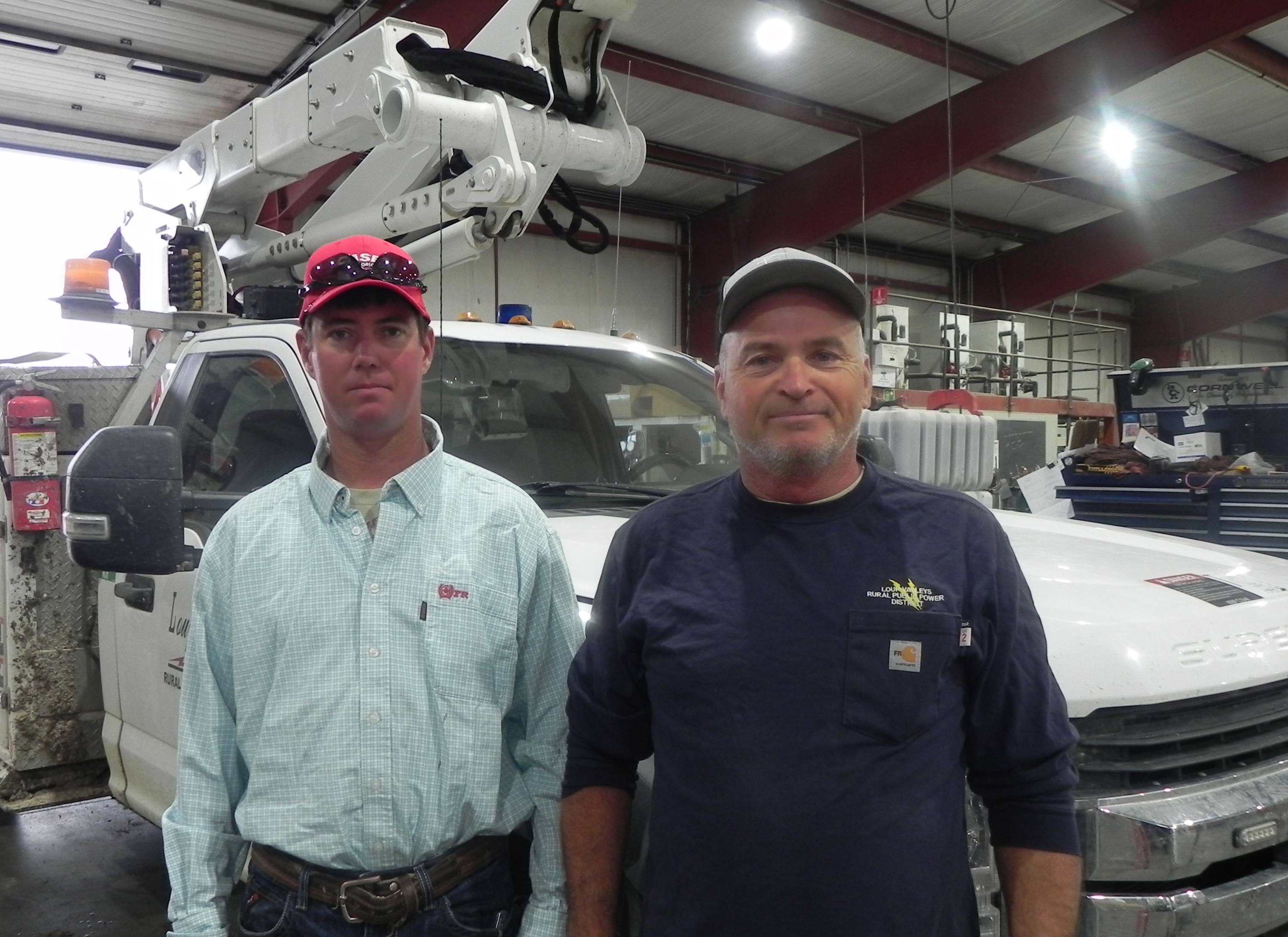 When they aren’t helping stranded motorists, Loup Valleys Rural Public Power District’s Nick Schaaf (left) and Bruce Koch keep the lights on.